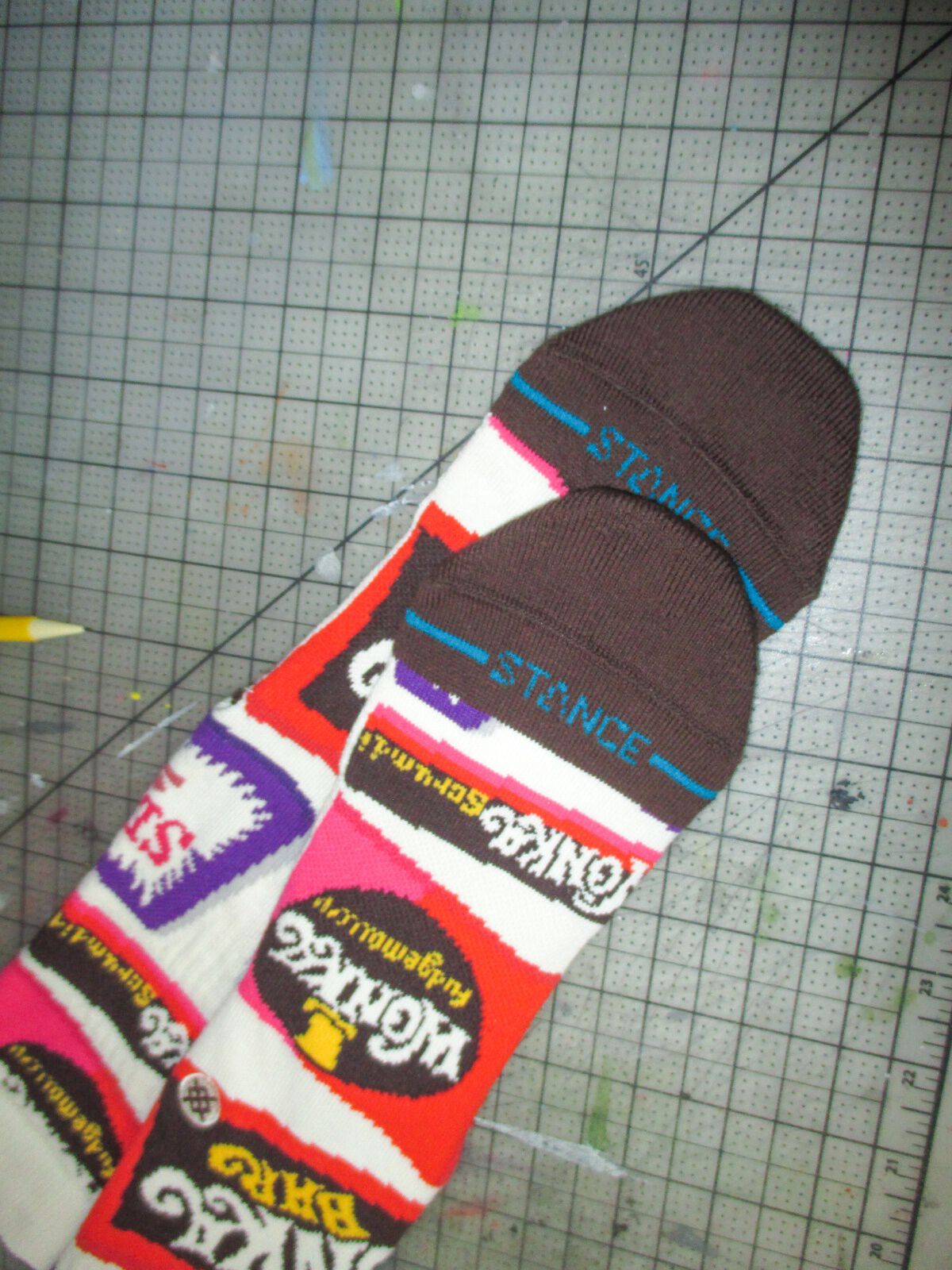 Willy Wonka x Stance socks layered on top of a grid background