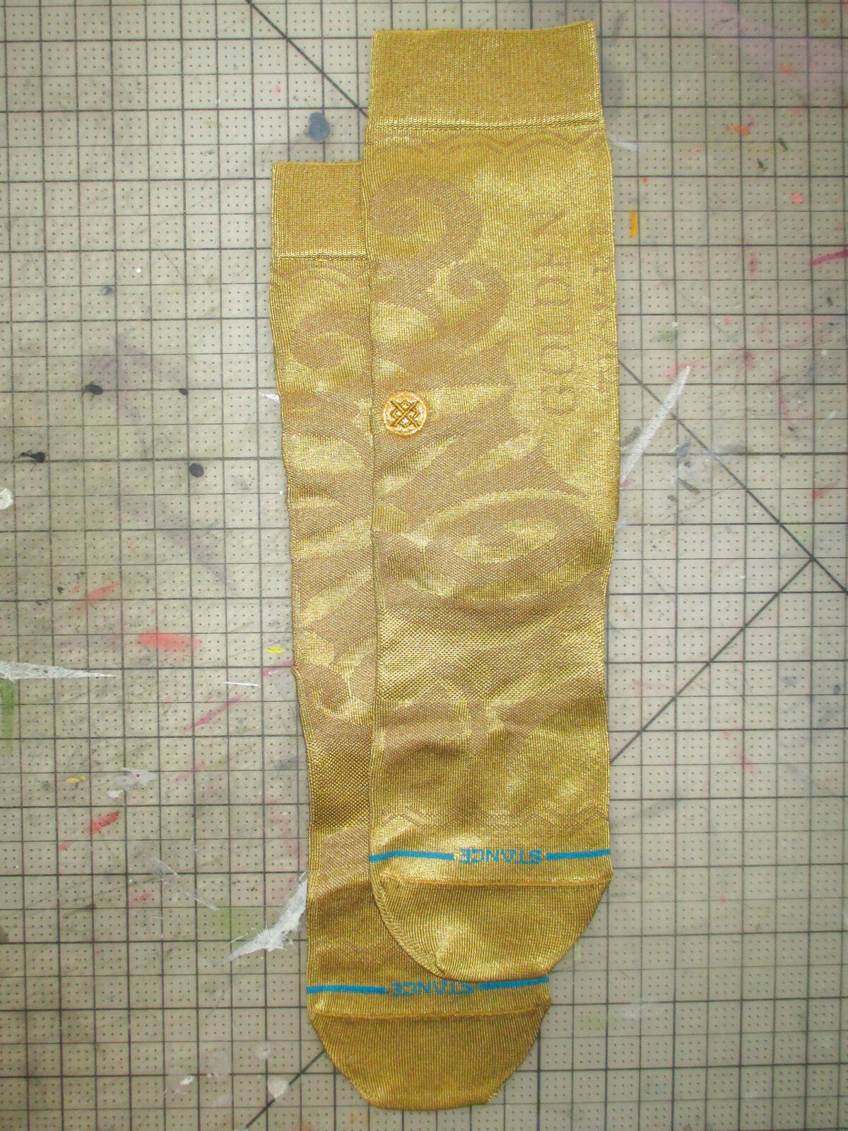 Willy Wonka x Stance socks layered on top of a grid background